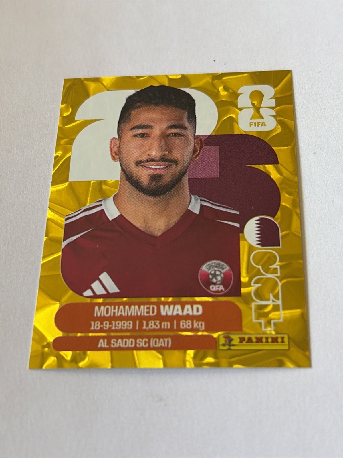 2026 Panini FIFA World Cup Stickers – Mohammed Waad Gold Crumple #QAT 14 Qatar