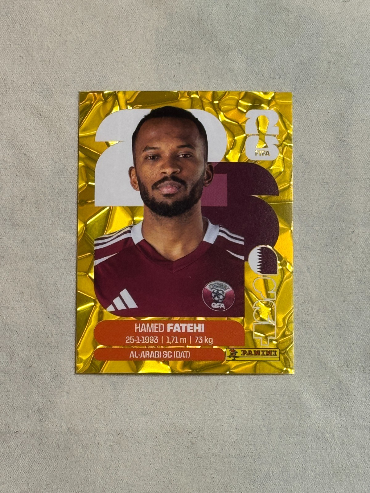 2026 Panini FIFA World Cup Sticker Gold Flood Crumple Hamed Fatehi #QAT12