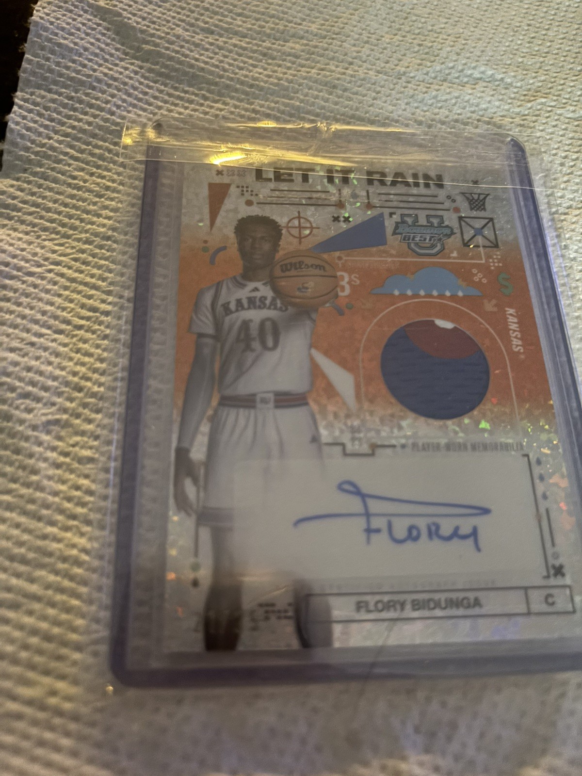2024-25 Bowman’s Best U Flory Bidunga Rain Patch Auto Orange Mini Diamond #/25