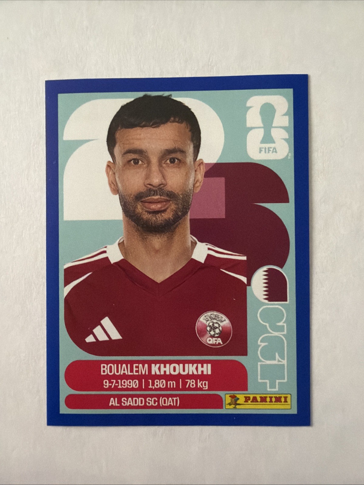 2026 Panini FIFA World Cup Sticker Boualem Khoukhi #QAT 6 – Blue Parallel