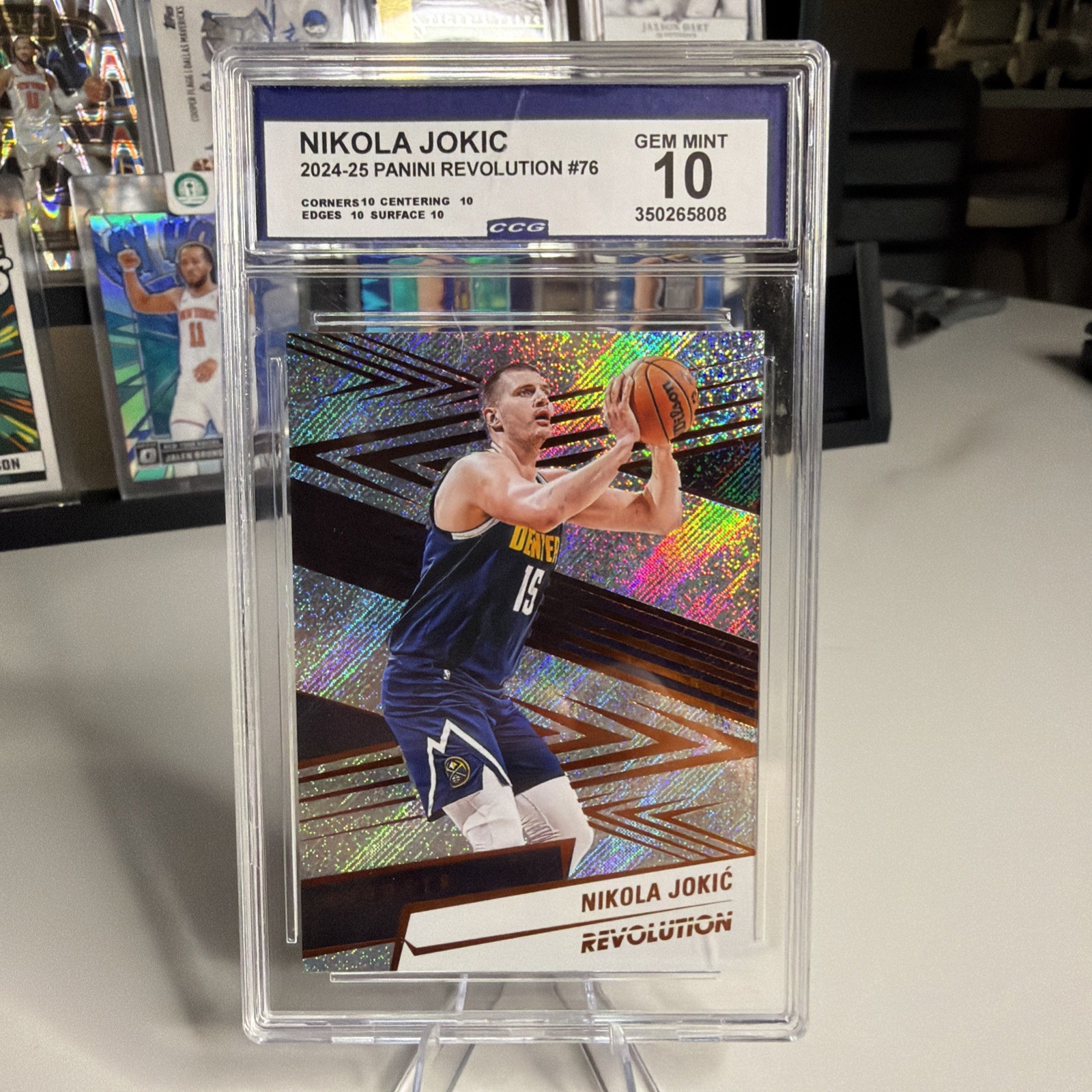 Nikola Jokic CCG 10 2024-25 Panini Revolution #76 Gem Mint 10