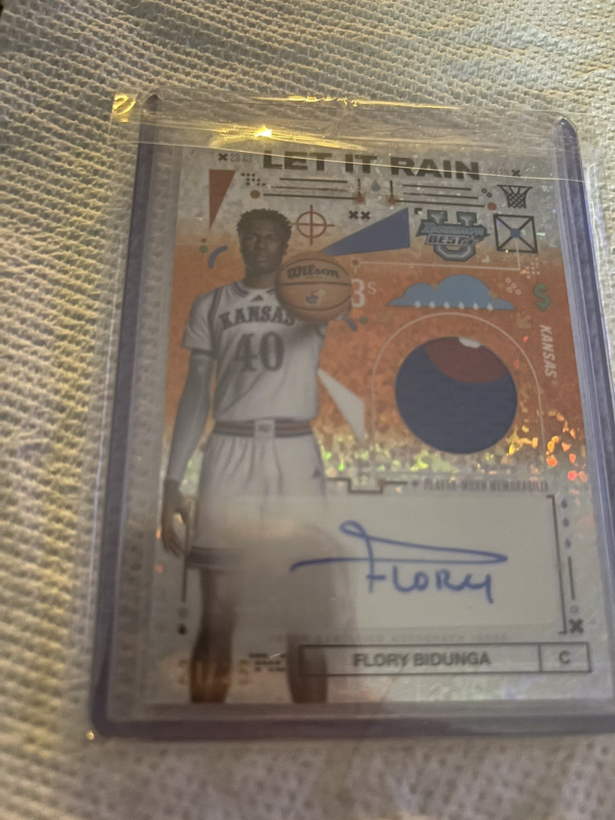 2024-25 Bowman’s Best U Flory Bidunga Rain Patch Auto Orange Mini Diamond #/25