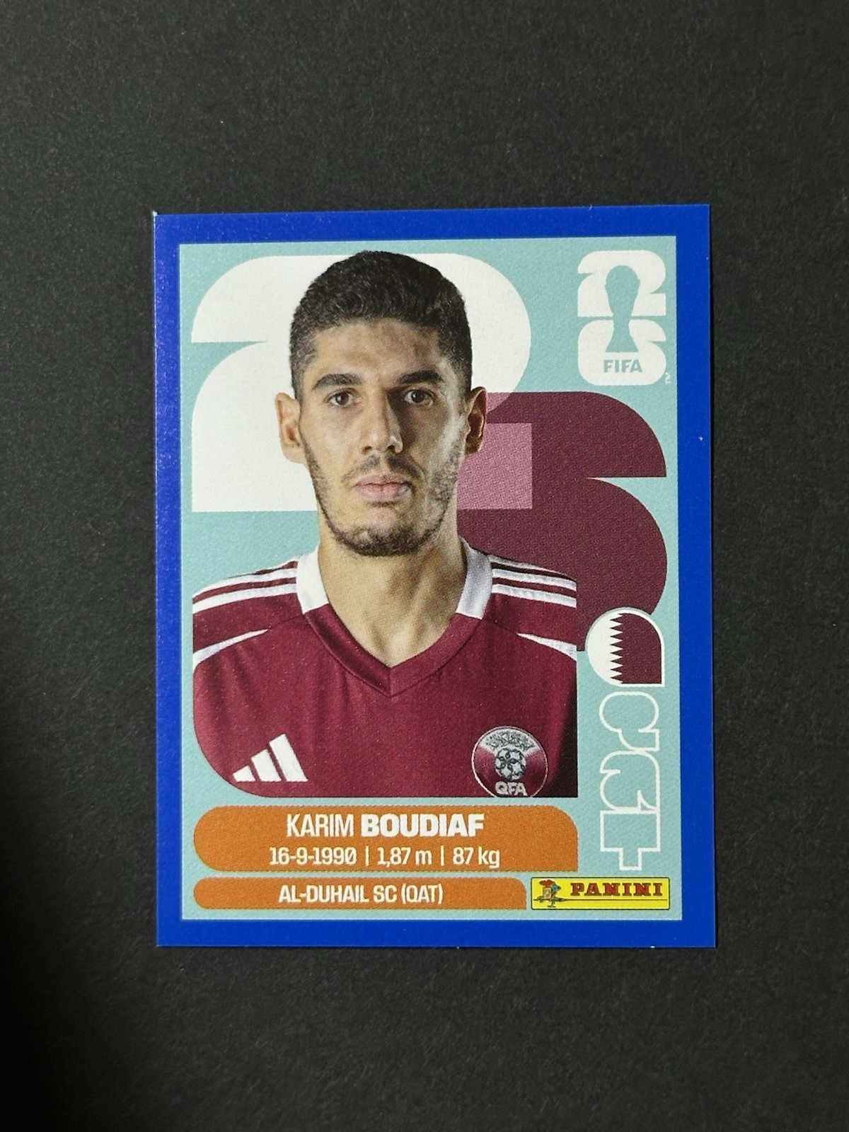 2026 Panini FIFA World Cup Karim Boudiaf Blue Parallel Sticker QAT 10 Qatar