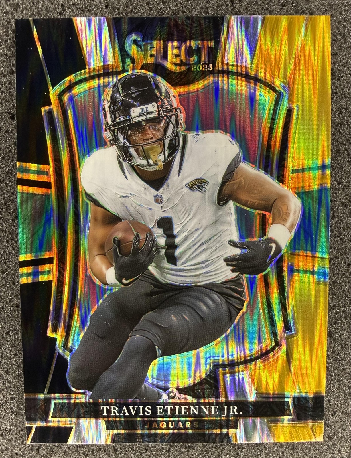 2025 Panini Select #130 Travis Etienne Jr. Black and Gold Prizm Shock