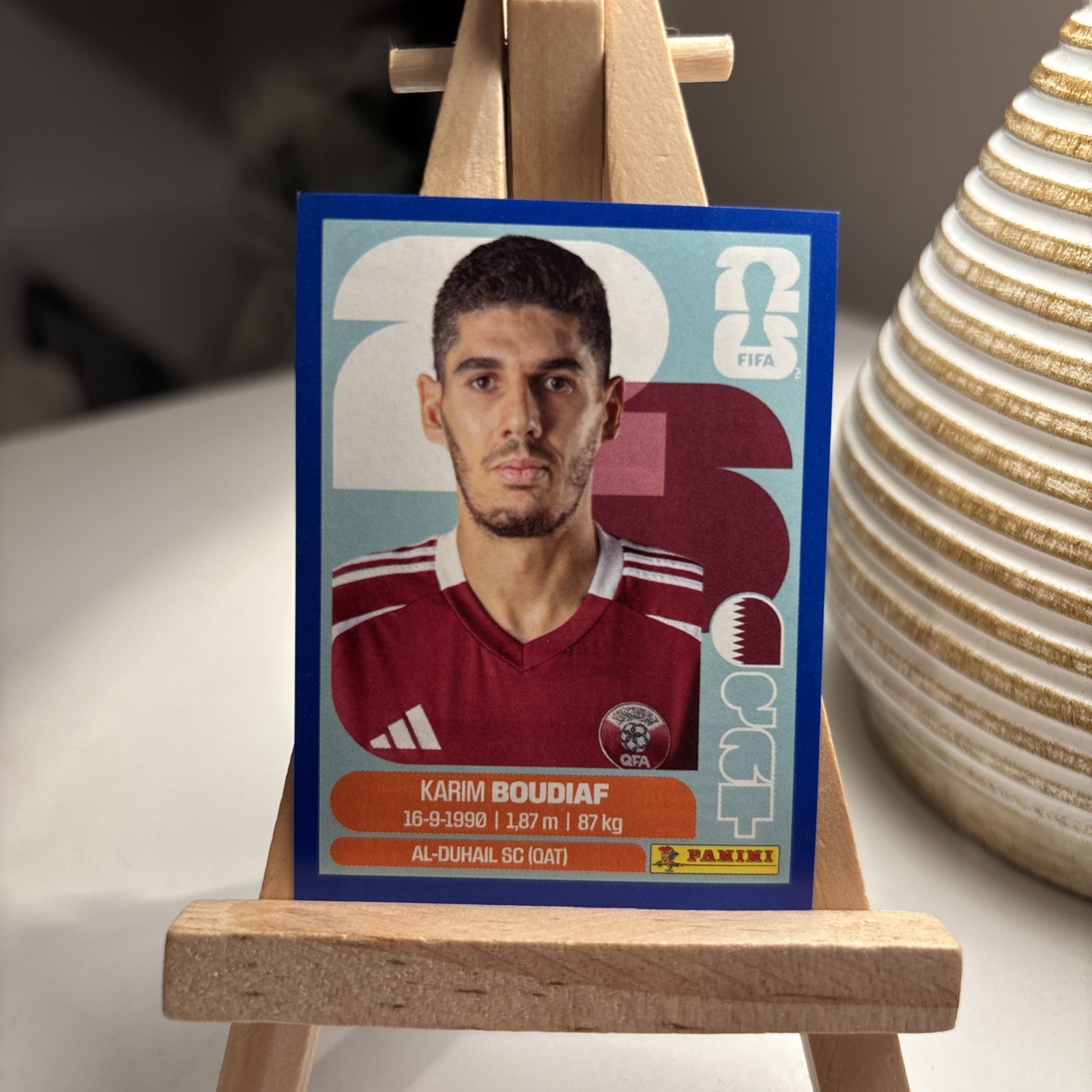 2026 Panini World Cup Sticker – Karim Boudiaf Blue Parallel/Border QAT#10