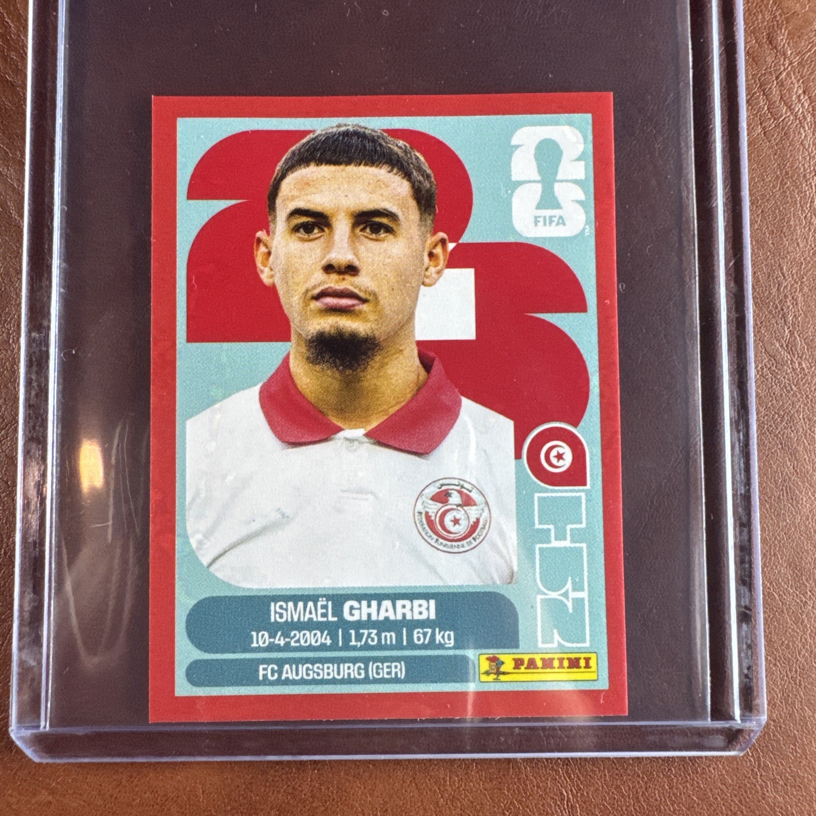 2026 Panini FIFA World Cup USA Sticker TUN18 Ismael Gharbi Red Parallel Tunisia