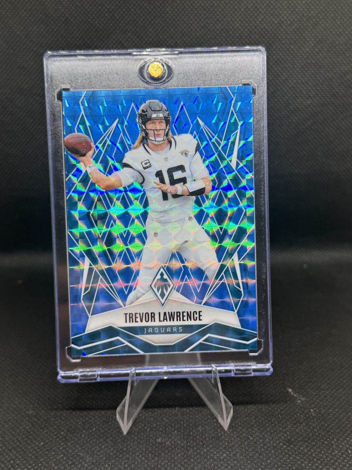 2025 Panini Phoenix – Trevor Lawrence #15 Light Blue Pyramids /385 Jaguars NFL