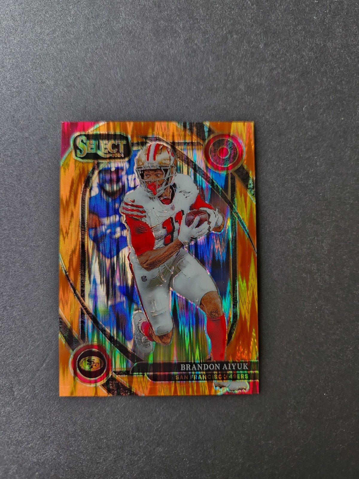 Brandon Aiyuk/399 2024 Panini Select – Club Level Orange Prizm Shock #205