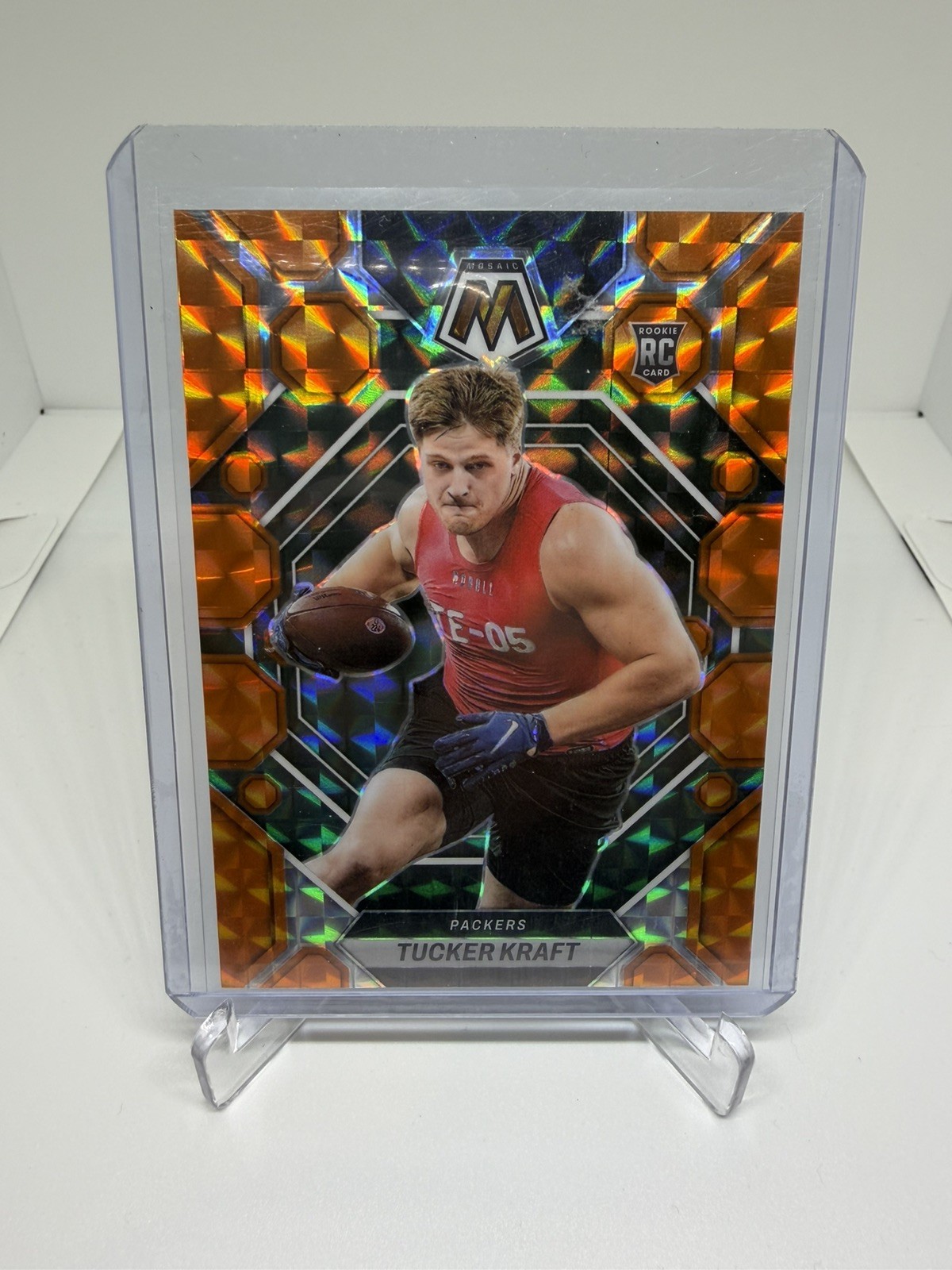 2023 Panini Mosaic – Rookies Tucker Kraft #368 Orange Mosaic Prizm /199 (RC)